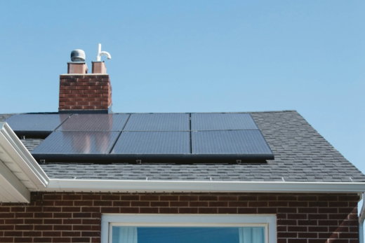 brown-brick-house-with-solar-panels-on-roof.jpg brown brick house with solar panels on roof